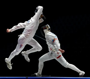 Ace Eldeib in action against Poland's Majgier in the Cadet Men's Epee event.